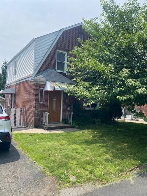 6 Stone Ave, Elmwood Park, NJ 07407 - view of front of house featuring a front yard and brick siding