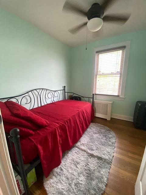 6 Stone Ave, Elmwood Park, NJ 07407 - bedroom featuring radiator, wood finished floors, and a ceiling fan
