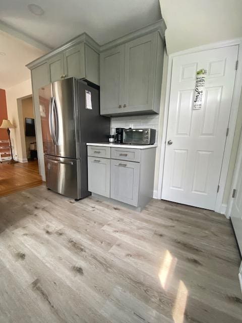 6 Stone Ave, Elmwood Park, NJ 07407 - kitchen with freestanding refrigerator, light wood-style flooring, and gray cabinets