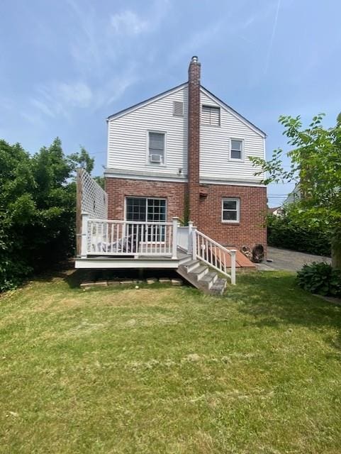 6 Stone Ave, Elmwood Park, NJ 07407 - back of property featuring a yard, a wooden deck, a chimney, and brick siding