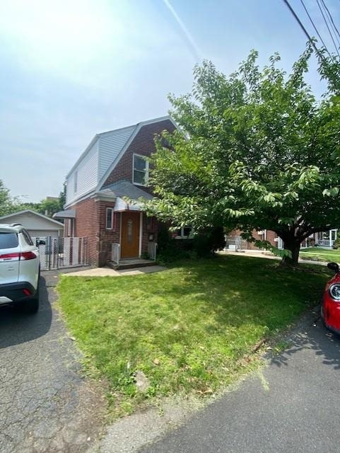 6 Stone Ave, Elmwood Park, NJ 07407 - view of front of home featuring a front lawn and brick siding