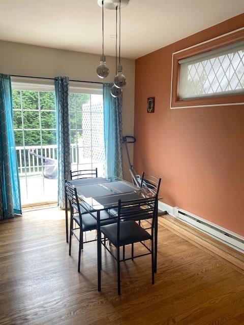 6 Stone Ave, Elmwood Park, NJ 07407 - dining space with wood finished floors and baseboard heating