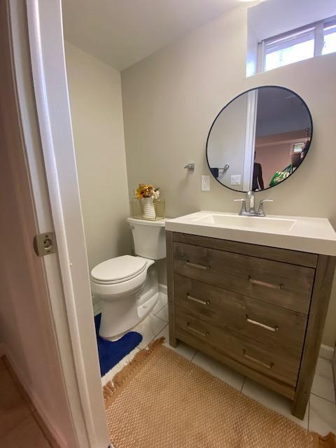 6 Stone Ave, Elmwood Park, NJ 07407 - half bathroom with tile patterned floors and vanity