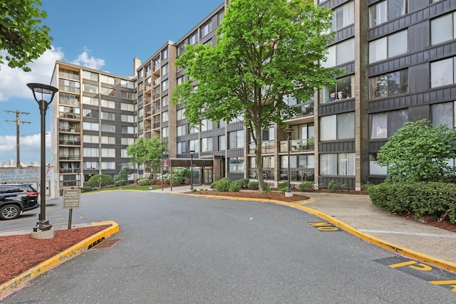 view of property featuring uncovered parking