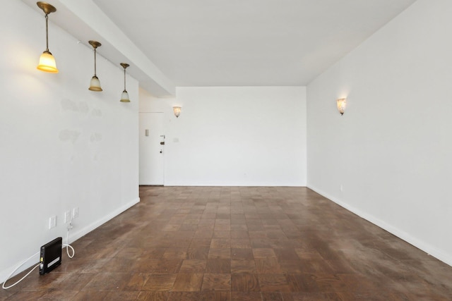 empty room featuring baseboards
