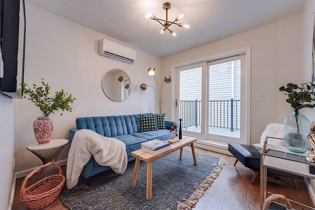 living room featuring an inviting chandelier, a wall unit AC, a wealth of natural light, and hardwood / wood-style floors