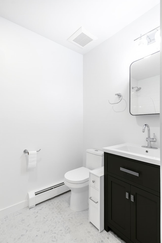 bathroom featuring vanity, toilet, a shower, and a baseboard radiator