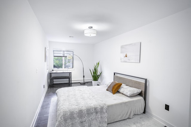 bedroom featuring wood-type flooring