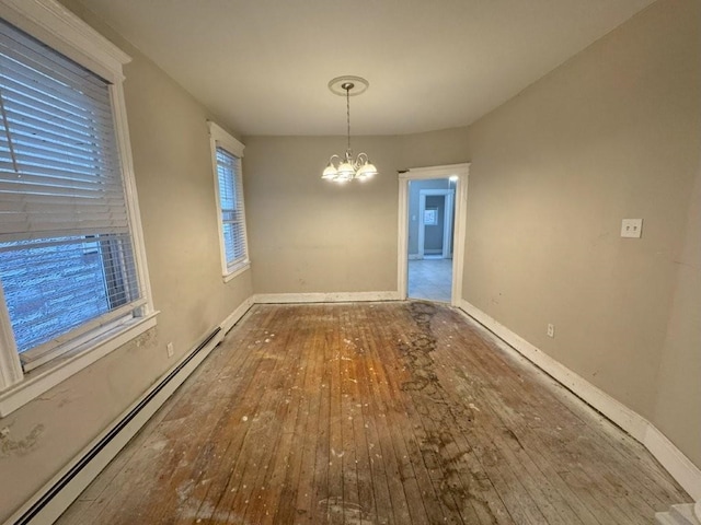 313 Pearsall Ave, Jersey City, NJ 07305 - unfurnished dining area with a baseboard radiator, hardwood / wood-style flooring, a chandelier, and baseboards