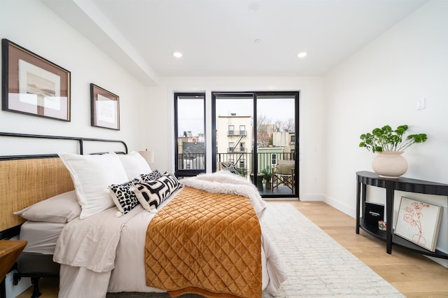 bedroom with access to exterior, recessed lighting, and light wood finished floors