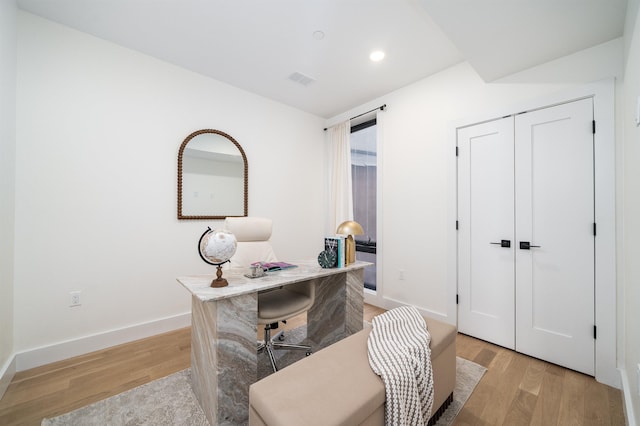 office area with recessed lighting, light wood-type flooring, baseboards, and visible vents