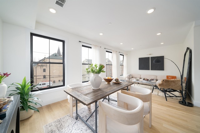 office featuring light wood-style flooring, recessed lighting, visible vents, and baseboards