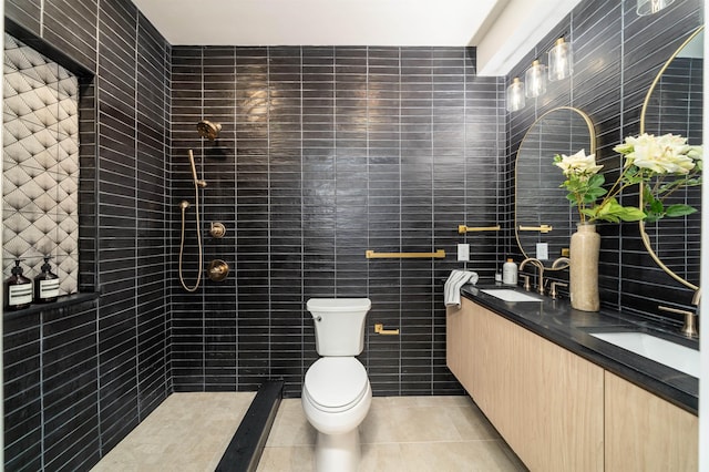 full bath featuring tile patterned floors, toilet, tile walls, and a sink