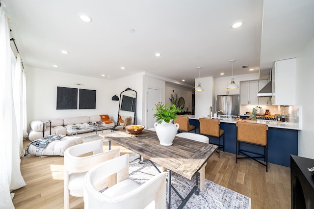 living room with recessed lighting and light wood-type flooring