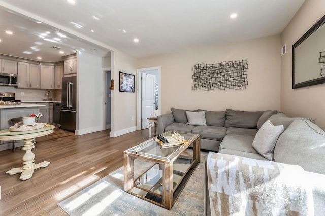801 Willow Ave Unit 3R, Hoboken, NJ 07030 - living room featuring recessed lighting, wood finished floors, and baseboards