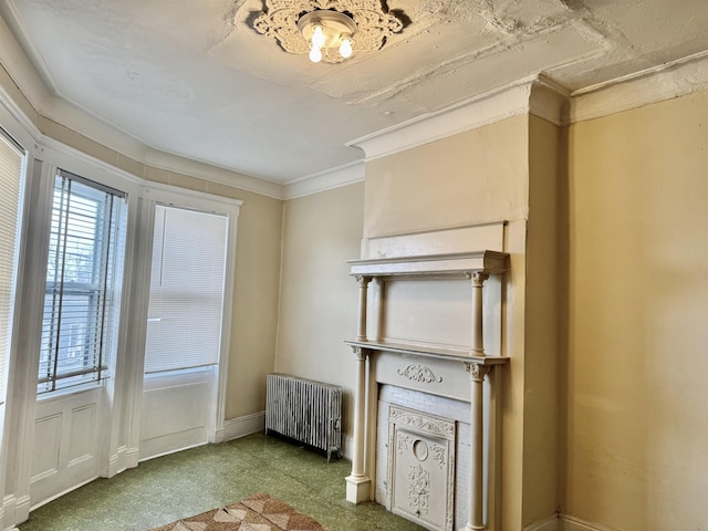 interior space featuring ornamental molding and radiator