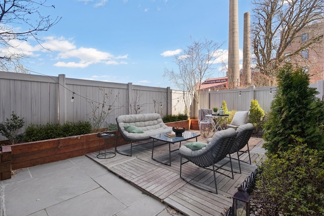 view of patio featuring a fenced backyard and outdoor lounge area