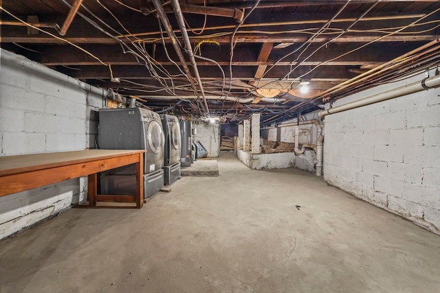 unfinished basement featuring washing machine and dryer