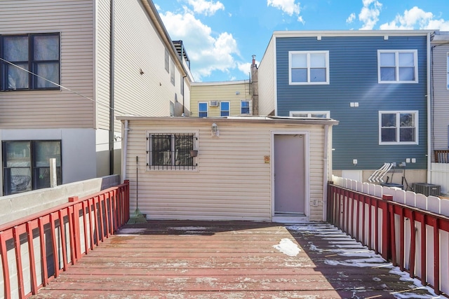 back of property featuring a wooden deck