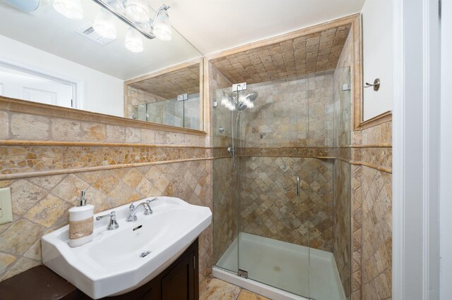 221 Clinton St Unit 3R, Hoboken, NJ 07030 - bathroom featuring a shower stall, tile walls, and vanity