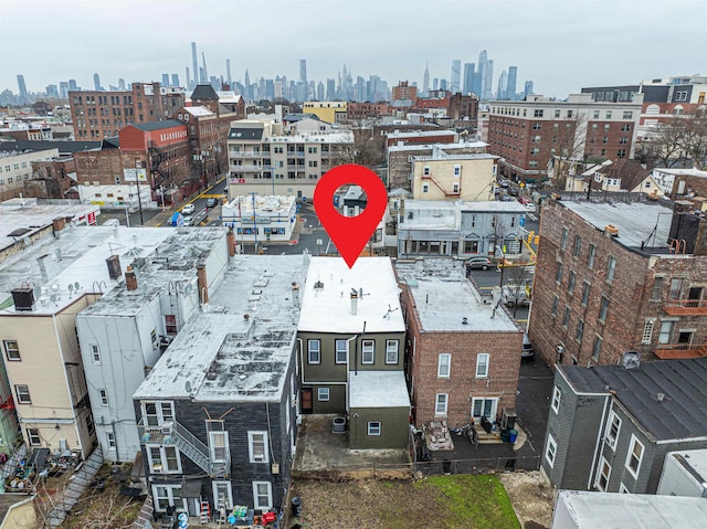 birds eye view of property with a city view