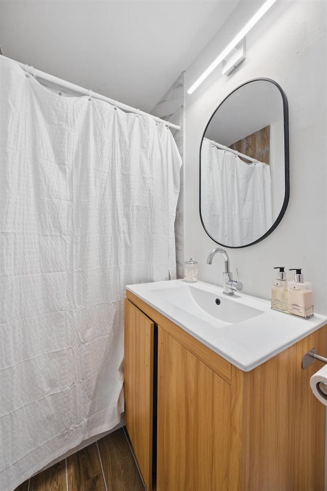 bathroom featuring vanity and wood finished floors