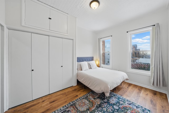 bedroom featuring hardwood / wood-style flooring and a closet