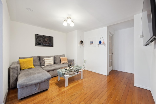 227 7th St, Jersey City, NJ 07302 - living area with baseboards and light wood finished floors