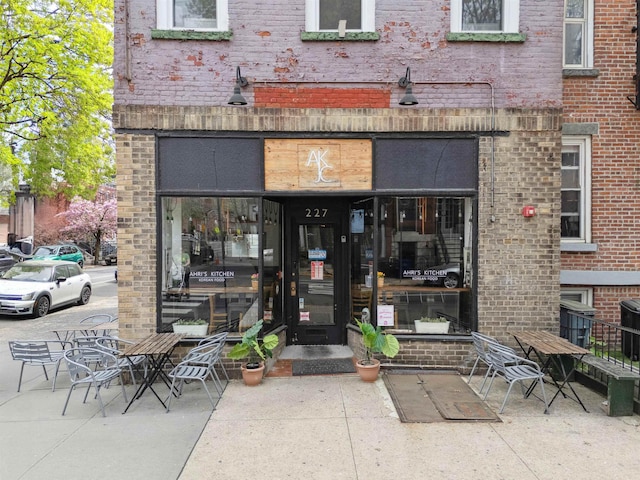 227 7th St, Jersey City, NJ 07302 - view of exterior entry featuring brick siding