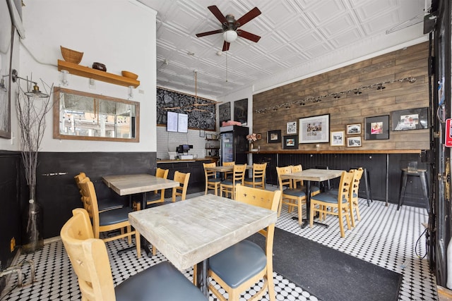 227 7th St, Jersey City, NJ 07302 - dining area with wood walls, ceiling fan, and an ornate ceiling