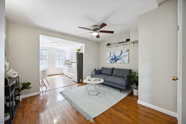 227 7th St, Jersey City, NJ 07302 - living area with baseboards, a ceiling fan, and hardwood / wood-style flooring