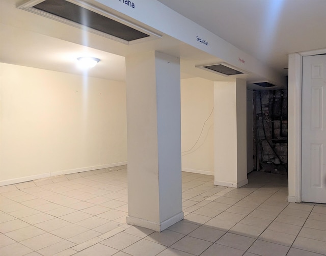 basement featuring light tile patterned floors