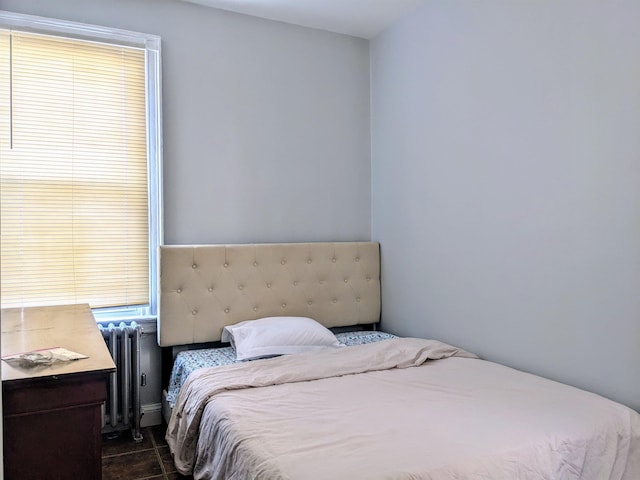 tiled bedroom with radiator