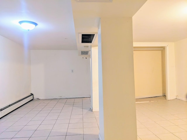 hallway featuring a baseboard radiator and light tile patterned floors