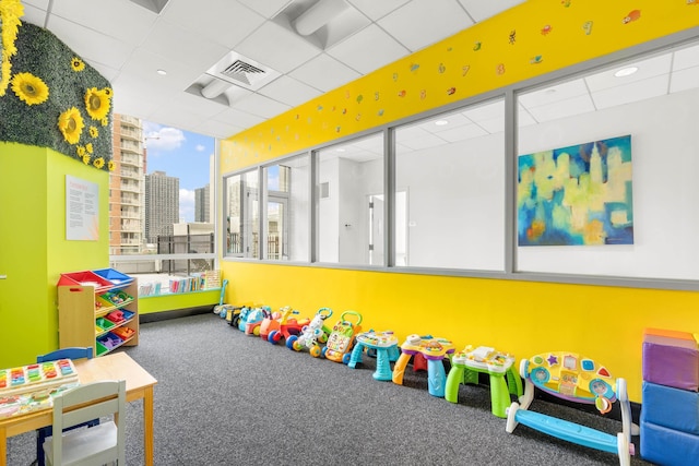 2 2nd St Unit 2106, Jersey City, NJ 07302 - rec room featuring carpet flooring, a drop ceiling, and a view of city