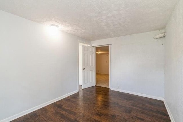 1109 12th St, North Bergen, NJ 07047 - spare room with wood finished floors, baseboards, and a textured ceiling