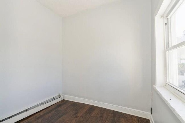 1109 12th St, North Bergen, NJ 07047 - unfurnished room with a baseboard radiator, baseboards, and dark wood-type flooring