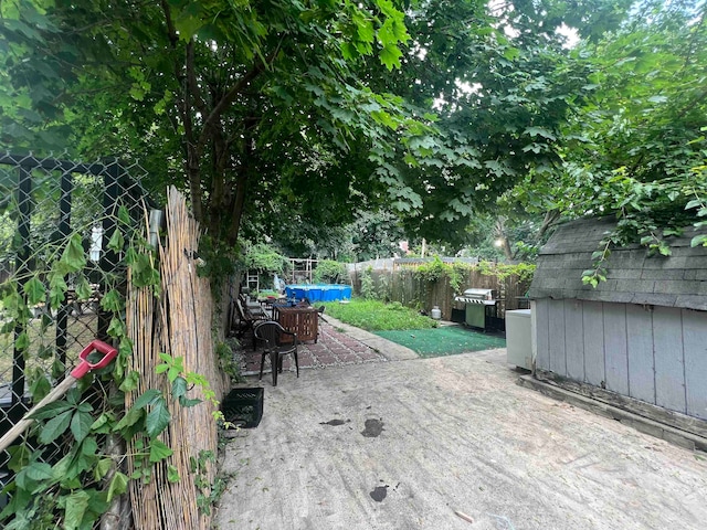 view of patio featuring a swimming pool