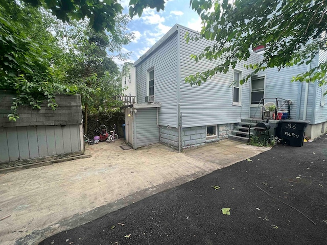 view of property exterior featuring a patio area