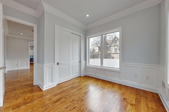30 Cortland Pl, Cliffside Park, NJ 07010 - unfurnished bedroom featuring recessed lighting, a wainscoted wall, a closet, light wood finished floors, and crown molding