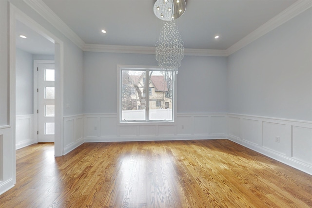 30 Cortland Pl, Cliffside Park, NJ 07010 - unfurnished room with crown molding, recessed lighting, light wood-style flooring, and an inviting chandelier