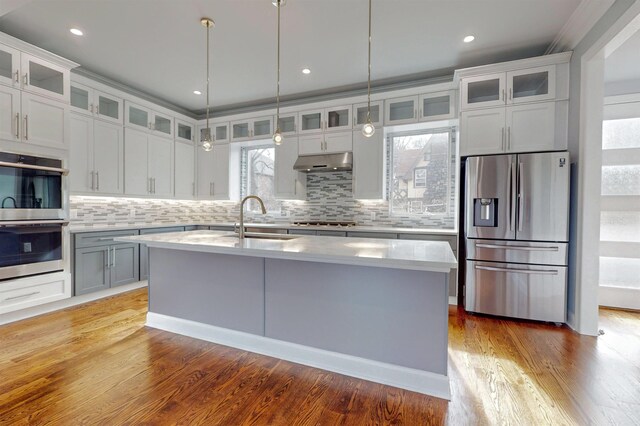 30 Cortland Pl, Cliffside Park, NJ 07010 - kitchen with light countertops, appliances with stainless steel finishes, a sink, and under cabinet range hood
