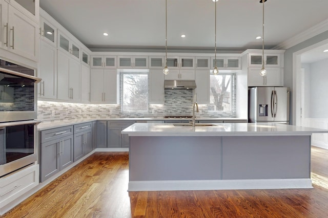 30 Cortland Pl, Cliffside Park, NJ 07010 - kitchen featuring under cabinet range hood, gray cabinetry, light wood-style floors, light countertops, and appliances with stainless steel finishes