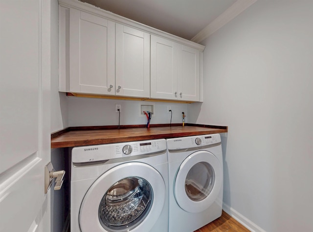 30 Cortland Pl, Cliffside Park, NJ 07010 - washroom featuring crown molding, washing machine and clothes dryer, cabinet space, light wood-type flooring, and baseboards