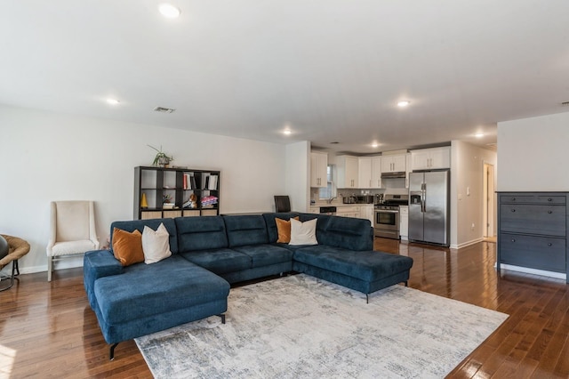 living room featuring dark hardwood / wood-style floors