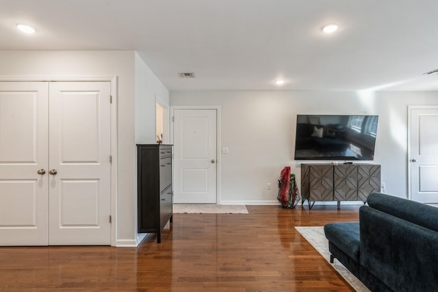 living room featuring dark hardwood / wood-style flooring