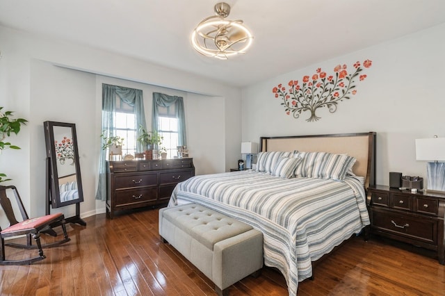 bedroom with dark wood-type flooring