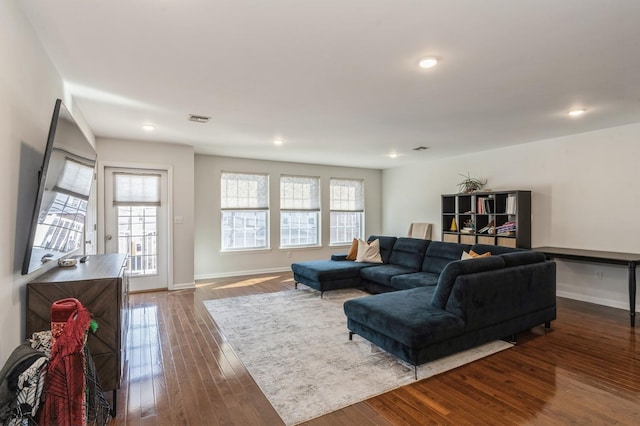 living room with dark hardwood / wood-style flooring