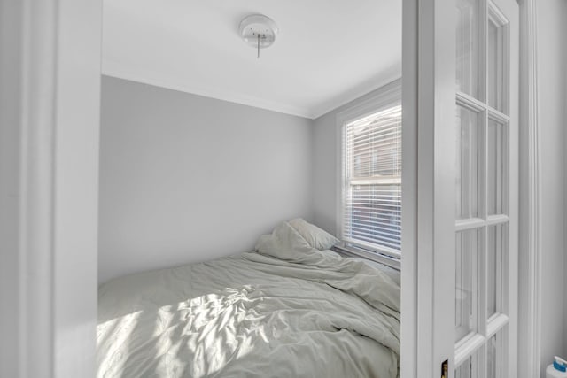 bedroom featuring ornamental molding