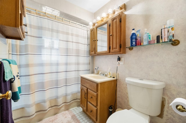 bathroom featuring a shower with shower curtain, vanity, and toilet